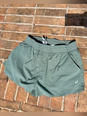 Women’s Green ASICS running shorts (Large)